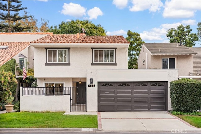 view of front facade with a garage and a front yard