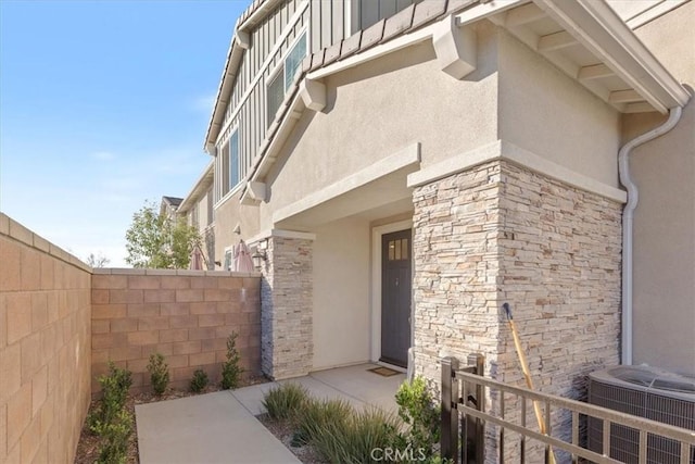 doorway to property with central air condition unit