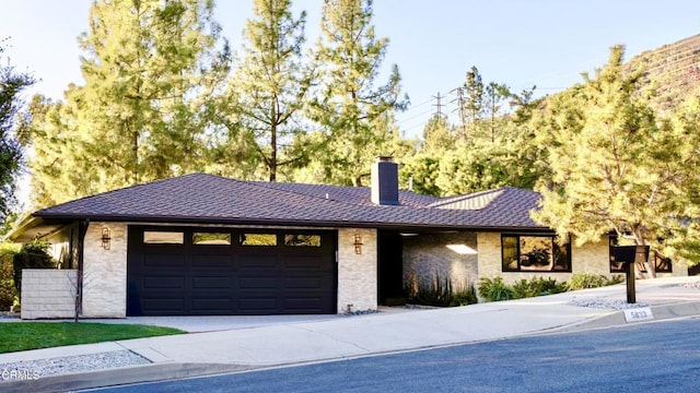 single story home featuring a garage