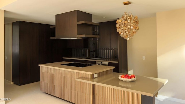 kitchen with sink, hanging light fixtures, ventilation hood, a kitchen island, and black electric cooktop