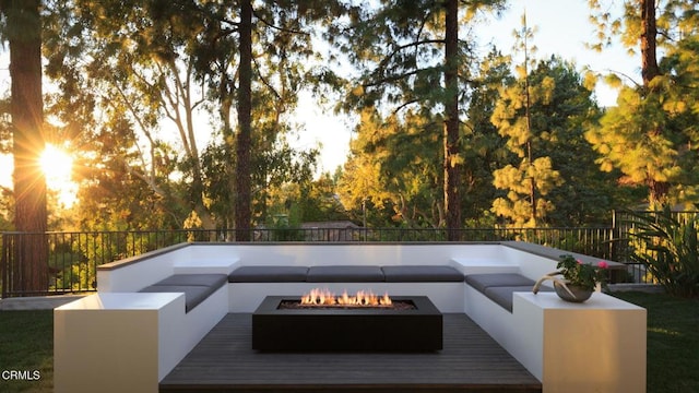 deck featuring an outdoor fire pit