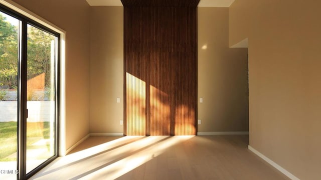 spare room featuring hardwood / wood-style floors