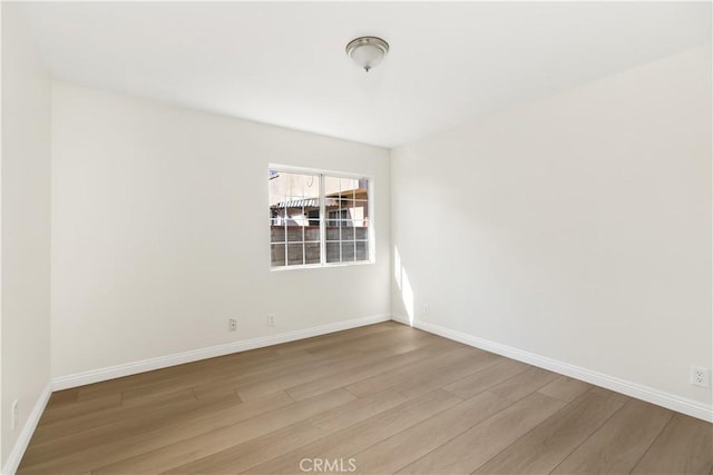 unfurnished room featuring light hardwood / wood-style flooring