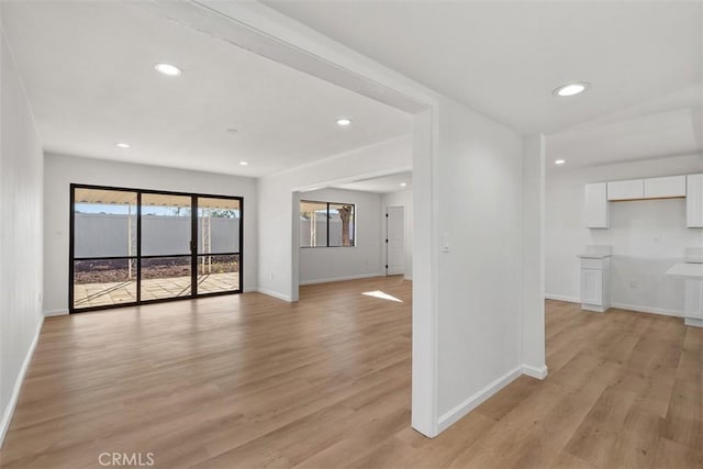 unfurnished living room with light hardwood / wood-style flooring