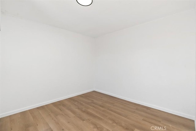 unfurnished room featuring hardwood / wood-style floors