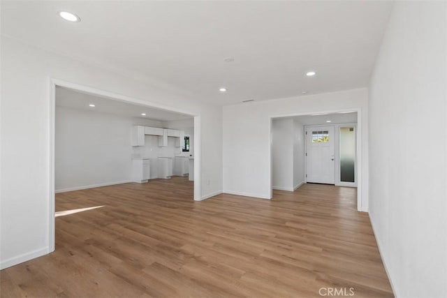 unfurnished living room featuring light hardwood / wood-style flooring