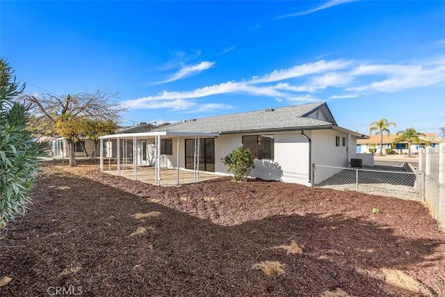 back of house with a patio area