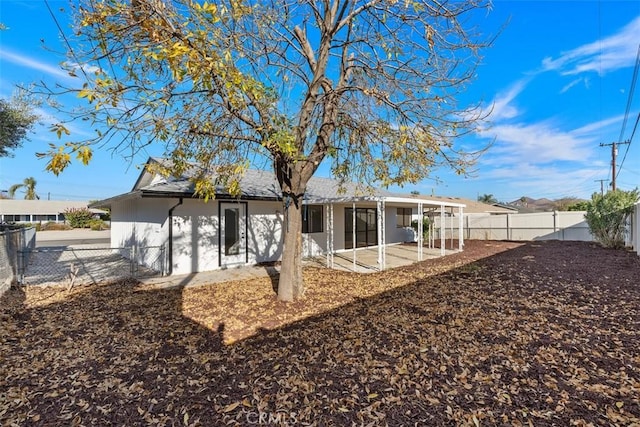 back of house with a patio area