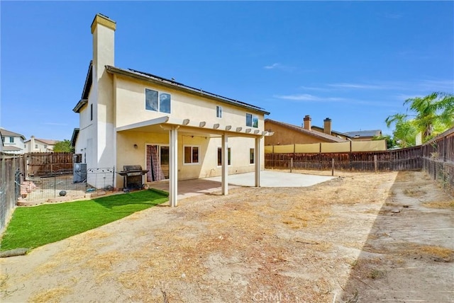 rear view of house featuring a patio area