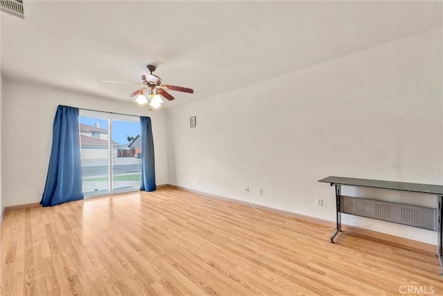 empty room with ceiling fan and light wood-type flooring