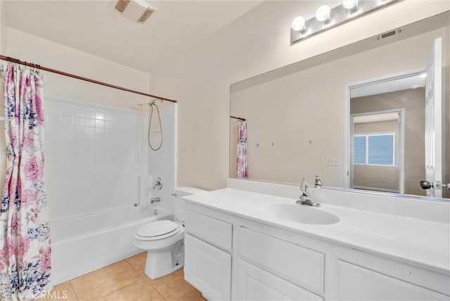 full bathroom with tile patterned floors, vanity, toilet, and shower / bath combo