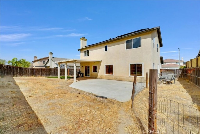 rear view of house with a patio