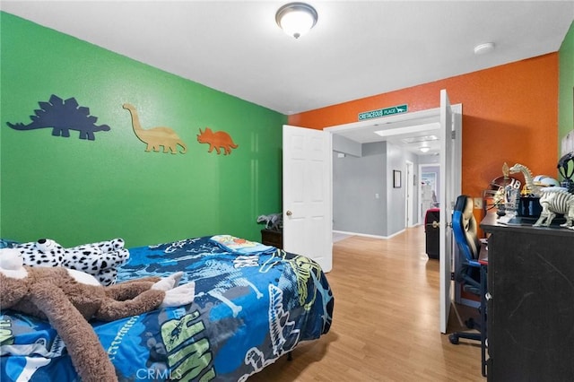 bedroom with hardwood / wood-style floors