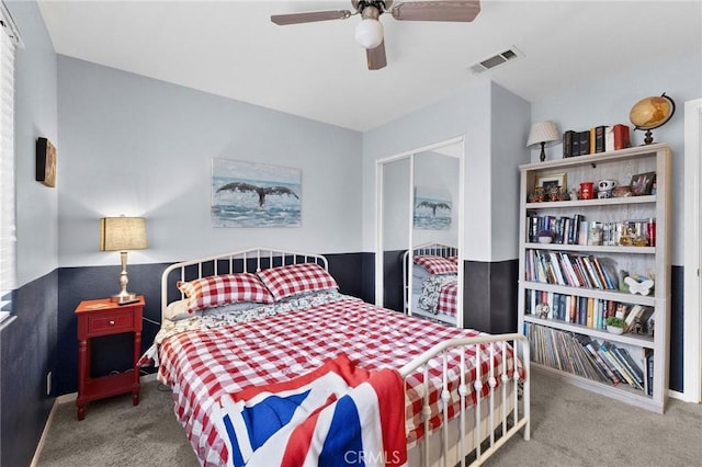 carpeted bedroom featuring ceiling fan