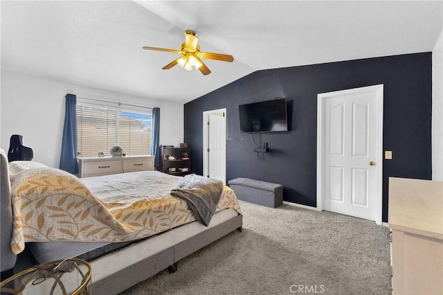 bedroom with ceiling fan, carpet, and vaulted ceiling