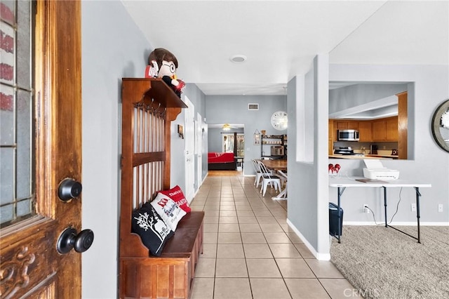 interior space with light tile patterned floors