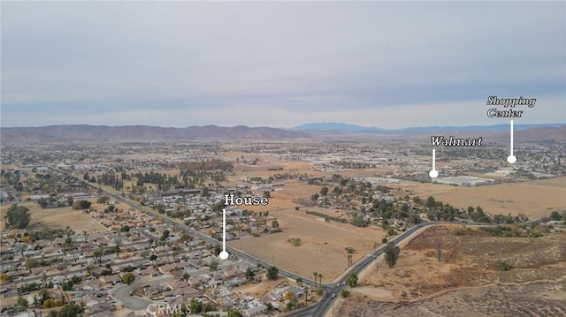 drone / aerial view featuring a mountain view