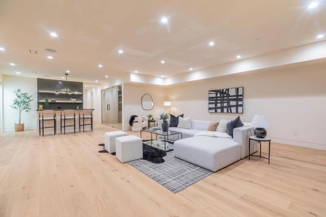 living room with light hardwood / wood-style flooring