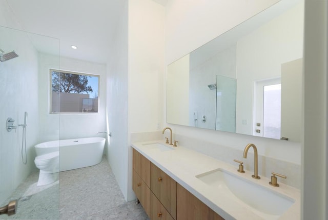 bathroom featuring separate shower and tub and vanity