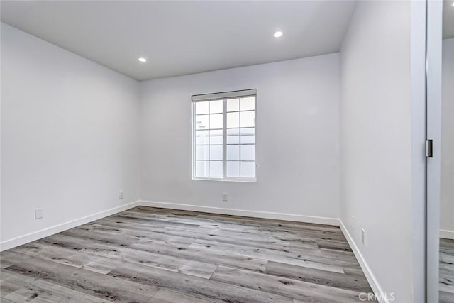 unfurnished room featuring light wood-type flooring