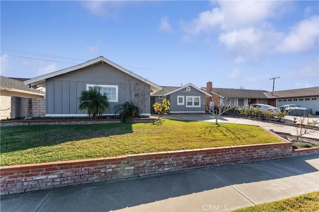 single story home featuring a front lawn, a garage, board and batten siding, and concrete driveway