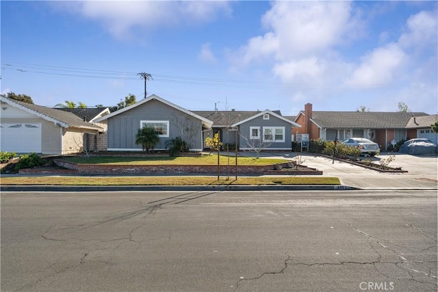 single story home with board and batten siding