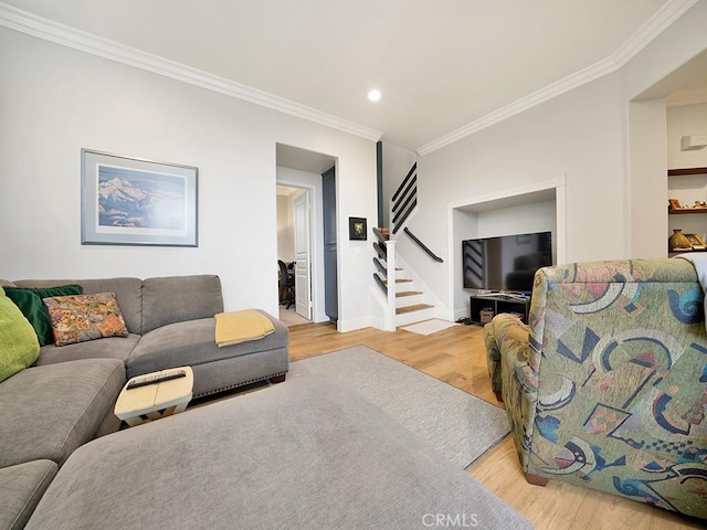 living room with crown molding and wood-type flooring