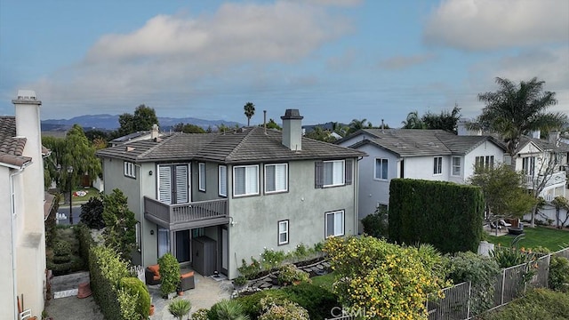 rear view of property with a balcony