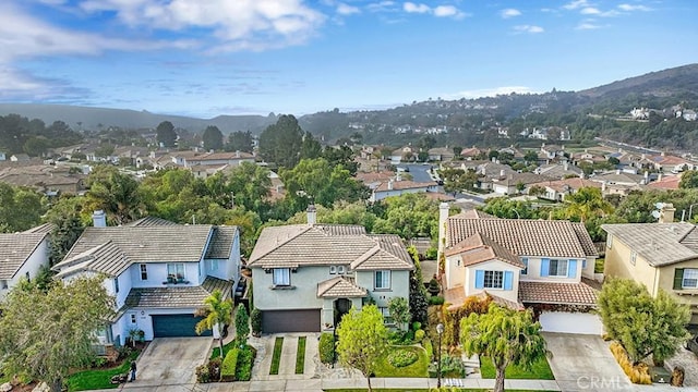 birds eye view of property with a mountain view