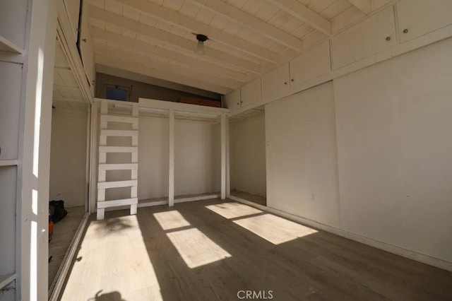 interior space featuring wood ceiling, hardwood / wood-style floors, and lofted ceiling with beams