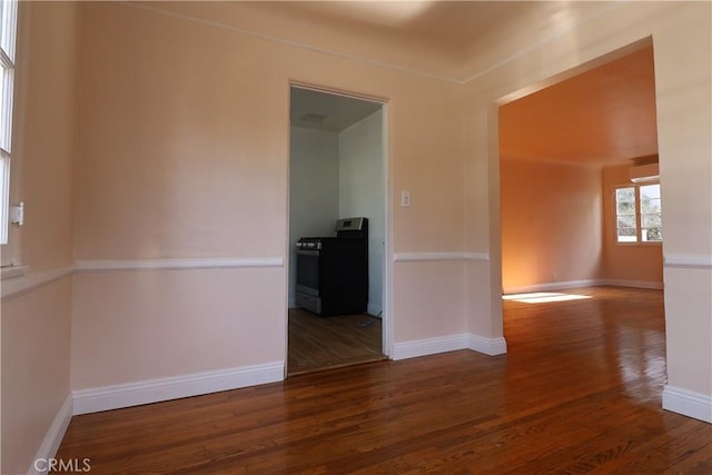 empty room featuring dark wood-type flooring