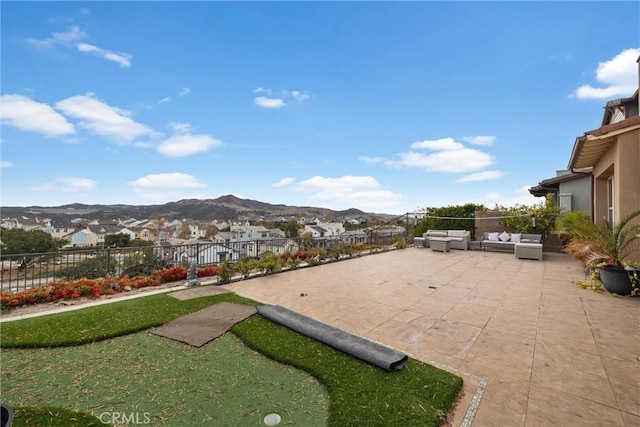 view of patio featuring outdoor lounge area and a mountain view