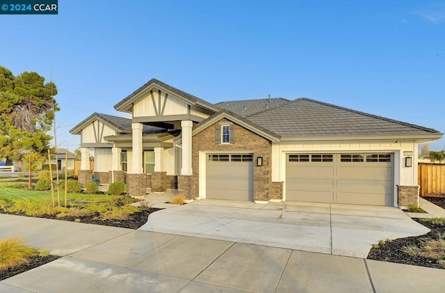 craftsman house with a garage