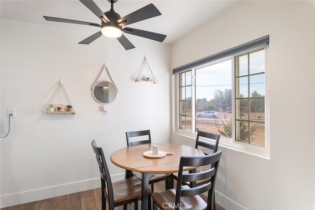 dining room featuring ceiling fan and dark hardwood / wood-style floors