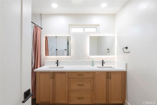 bathroom with a shower with curtain and vanity