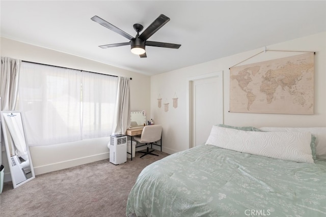 bedroom with ceiling fan and carpet floors