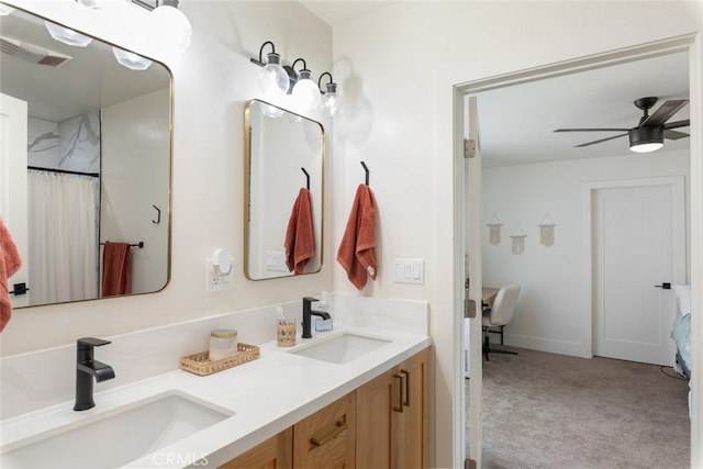 bathroom with ceiling fan and vanity