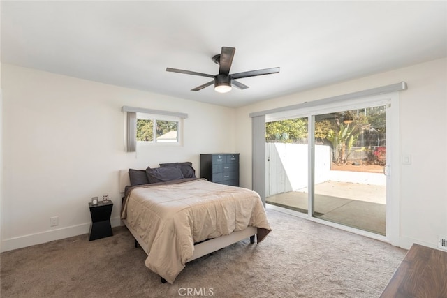 bedroom with access to exterior, light carpet, multiple windows, and ceiling fan