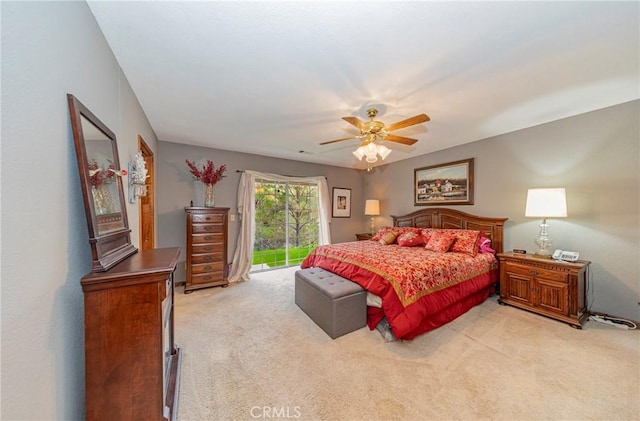 carpeted bedroom with access to outside and ceiling fan