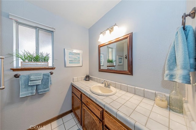 bathroom with tile patterned floors and vanity