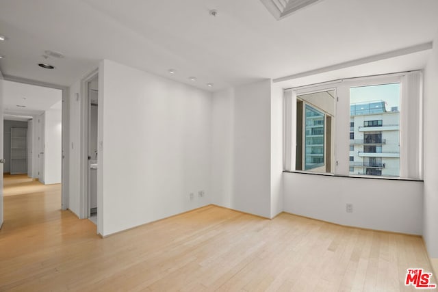 unfurnished room featuring light hardwood / wood-style flooring