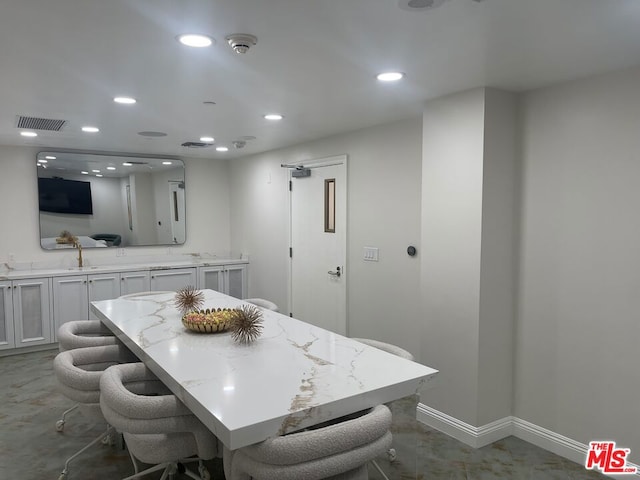 dining room featuring sink