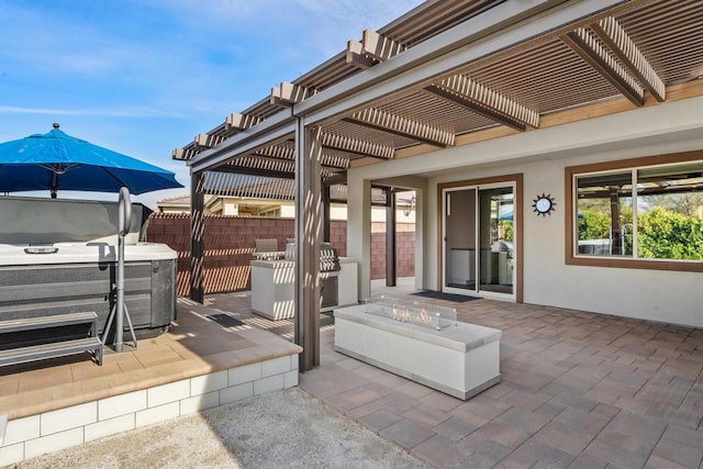 view of patio / terrace featuring an outdoor fire pit