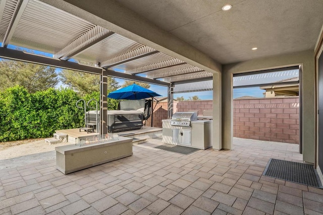 view of patio / terrace with area for grilling, a pergola, grilling area, and a hot tub