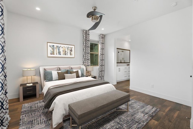 bedroom with dark hardwood / wood-style floors