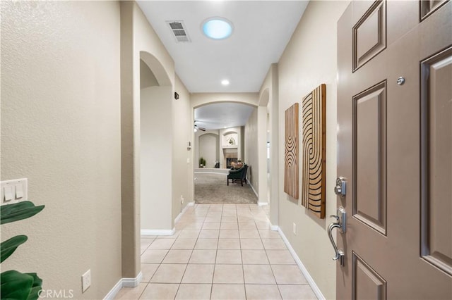 hall with light tile patterned flooring