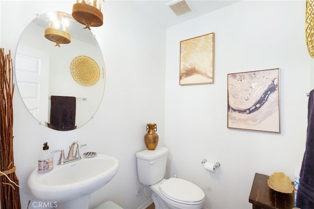 bathroom with toilet and sink