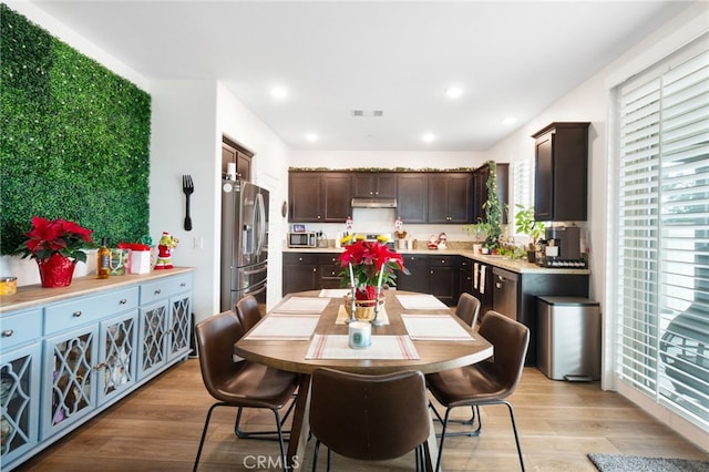 dining area featuring light wood-type flooring