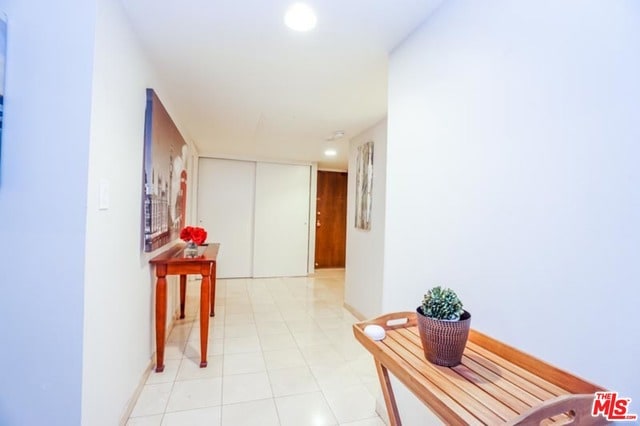 corridor with light tile patterned floors