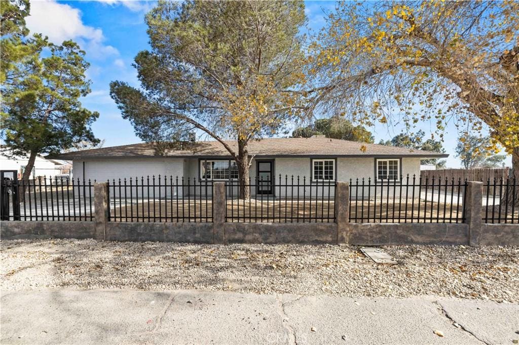 ranch-style home featuring a garage